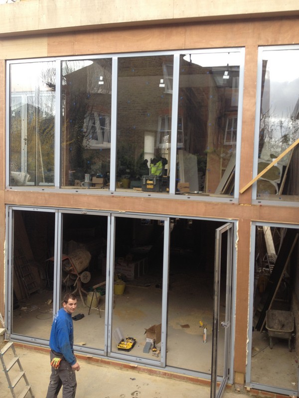 Aluminium bi-fold doors with two-storey glazing in Thornton Heath