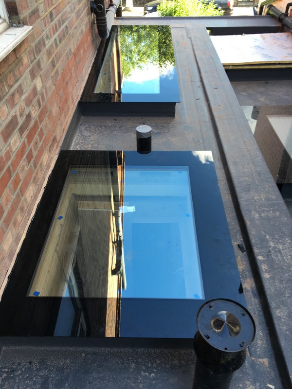 Multiple flat roof skylights on extension in Thornton Heath